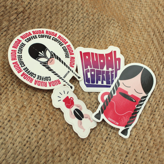 Set of stickers with 'Ruda Ruda Coffee' branding on a textured surface